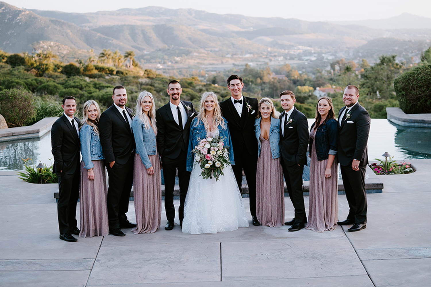 bridesmaid dresses with denim jackets Bride & Bridesmaids In Jean Jacket At Wedding