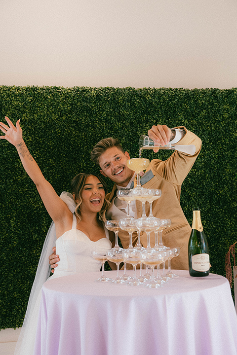 Bride and groom with champagne tower