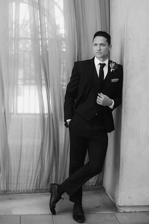 groom in a black tuxedo