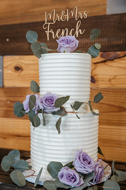 wedding cake with purple flowers