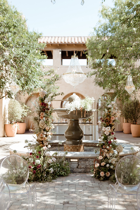 ceremony florals in cream, pink, and red