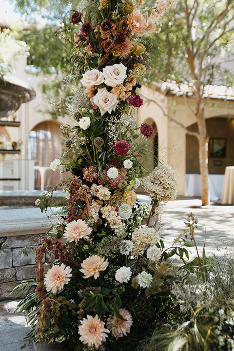 ceremony florals in cream, pink, and red