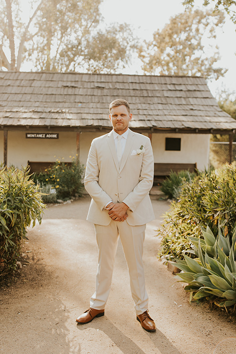 groom in tan suit