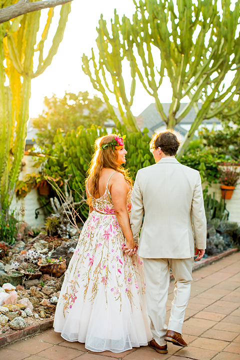 Bride and groom walking down path