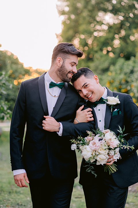 Grooms embracing