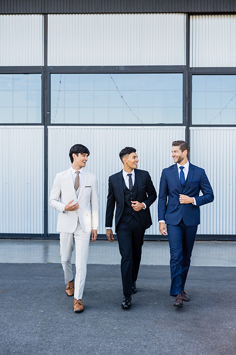 Wedding style guide image with three men in suits.