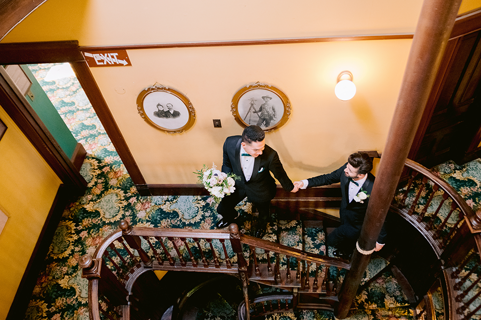 Grooms walking upstairs