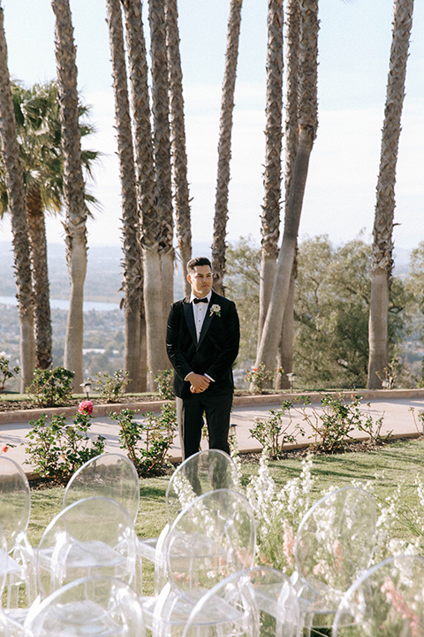 groom at the end of aisle