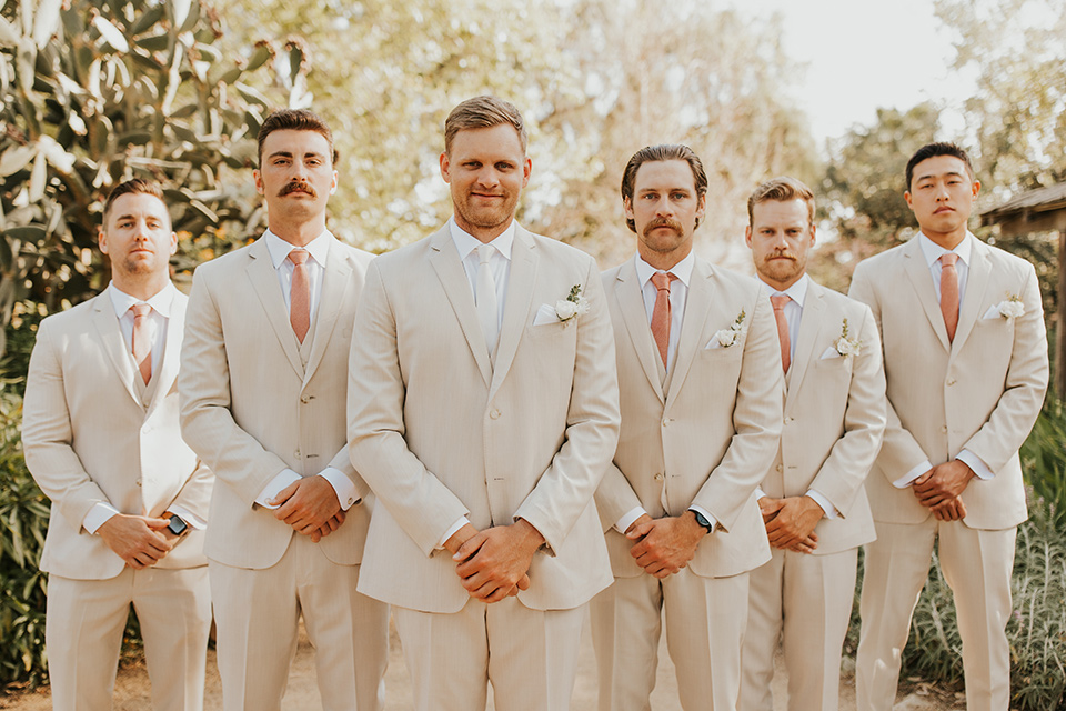 groomsmen in tan suit
