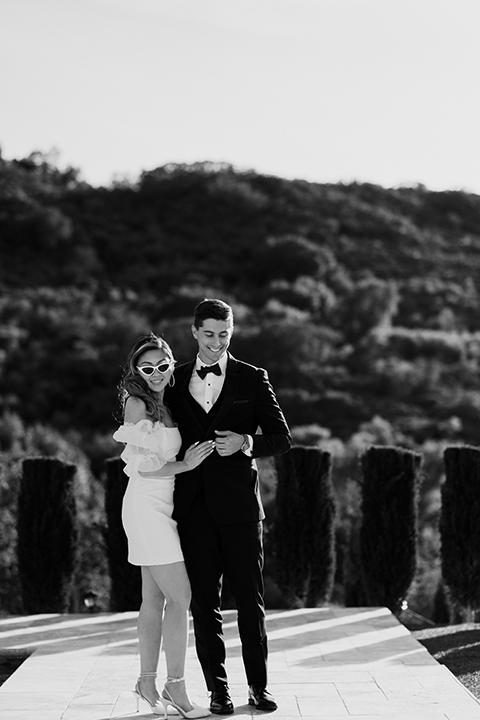 Black and white bride and groom holding hands