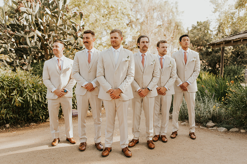 groomsmen in tan suit