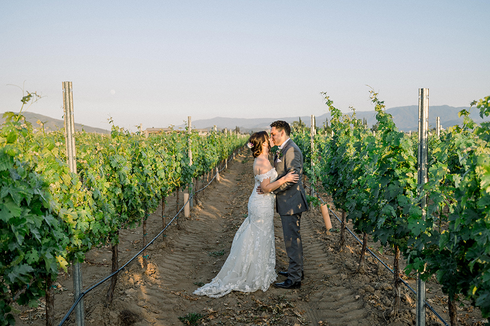 couple kissing in the winery