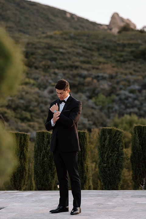 Groom solo shot with hills