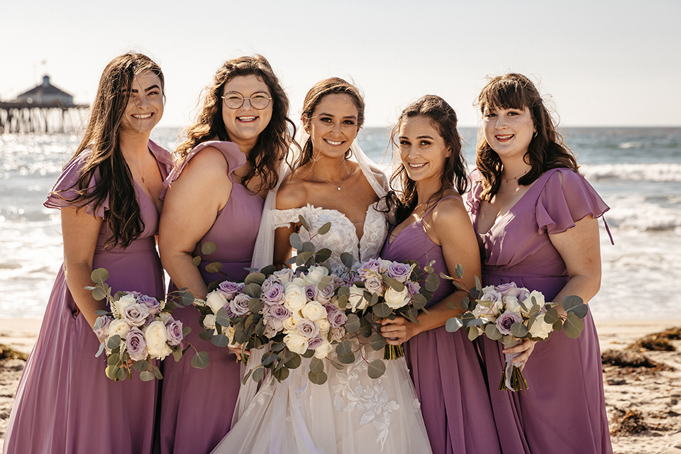 bridesmaids in lilac gowns in different styles