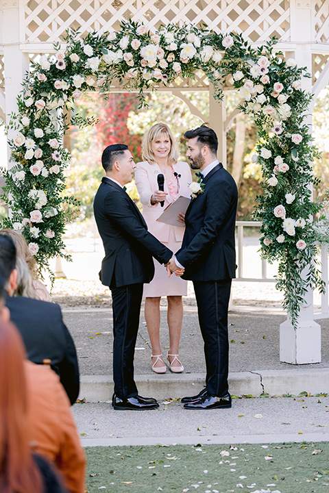 Ceremony image grooms at alter