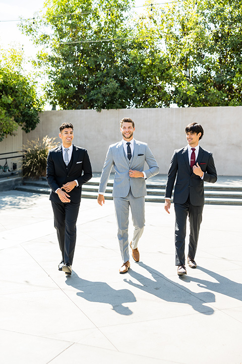 Modern wedding suit styles worn by three men.