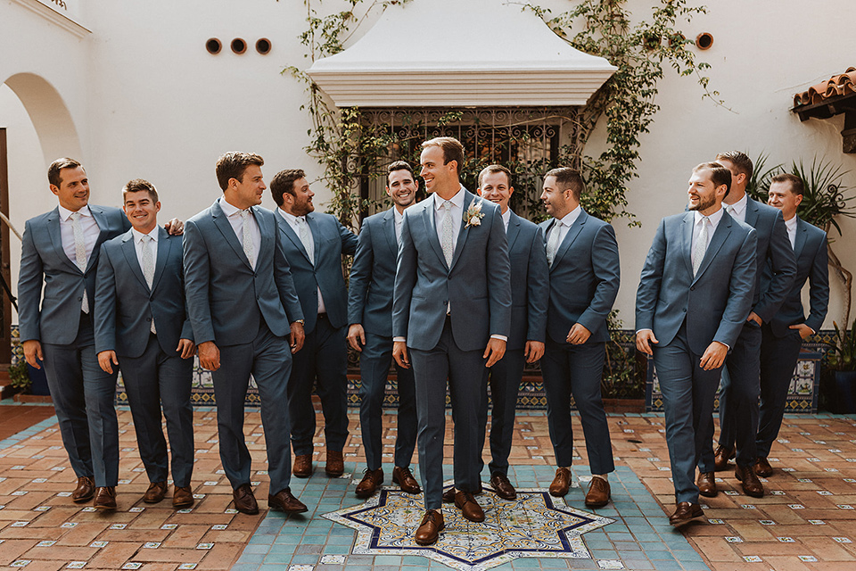 Michael Kors suits worn by the groom and groomsmen.