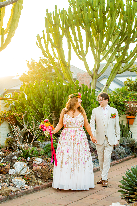 Bride and groom hand in hand walking