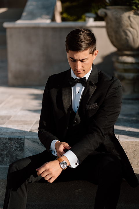 Groom sitting and posing