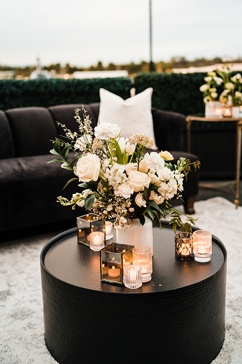 Close-up of a lush white and blush rose bouquet with delicate greenery, perfect for a modern romantic wedding