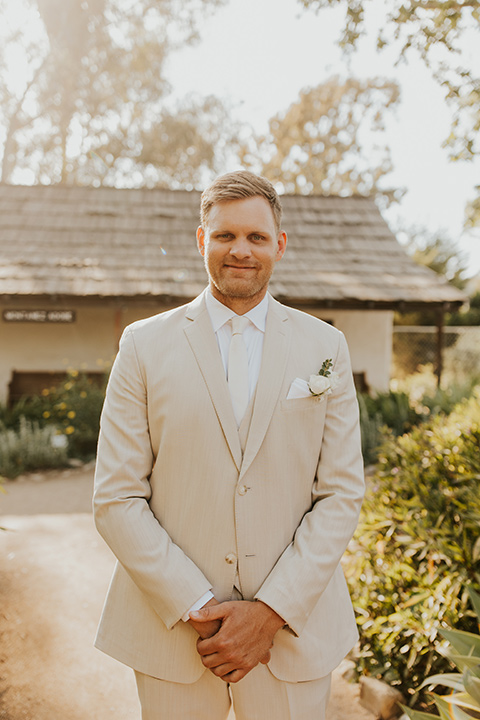groom in tan suit