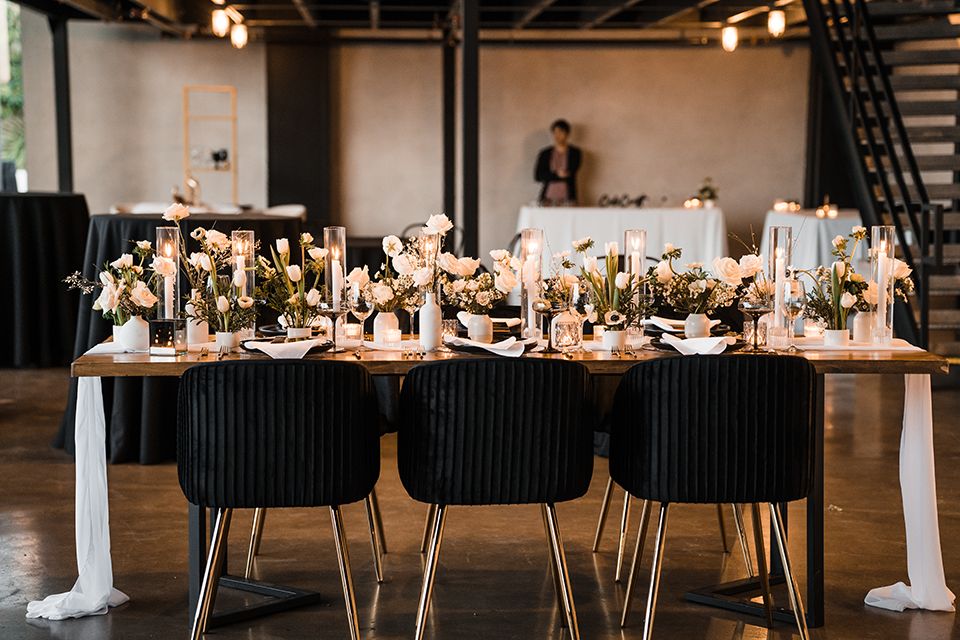 Elegant wedding tablescape featuring soft candlelight, neutral linens, and floral centerpieces for a timeless reception look